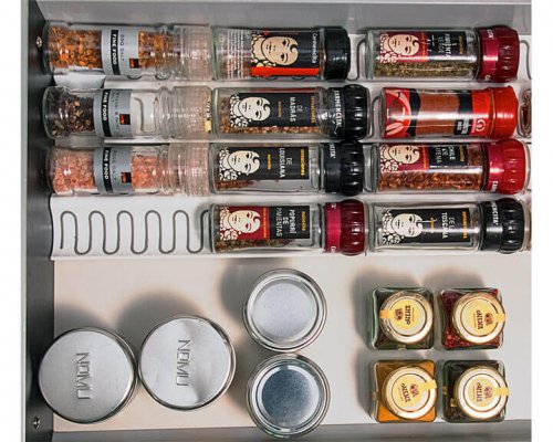 A way to store spices inside a drawer.