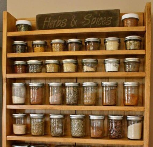 Spices on a wooden rack.