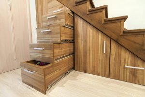 Using the space under the stairs for storage. 