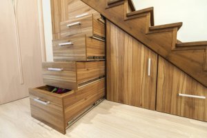 Using the space under the stairs for storage.