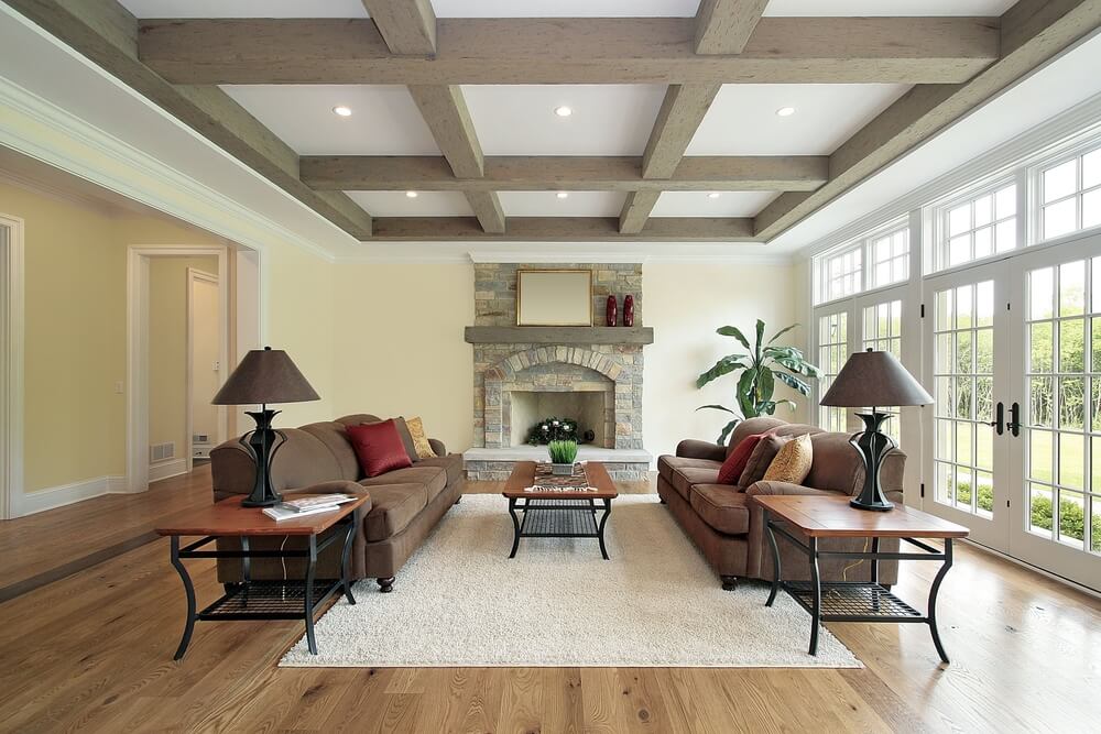 A living room with exposed beams in the ceiling.