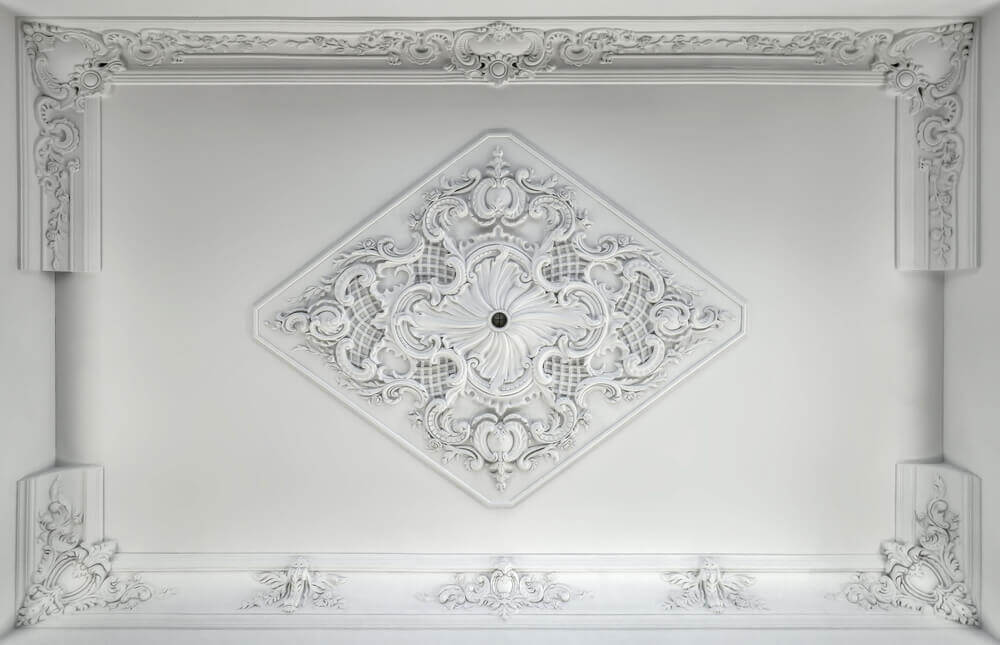 A ceiling with intricate moldings.