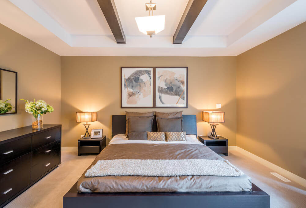 A bedroom with high ceilings.