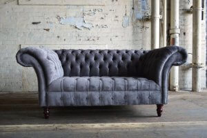 A velvet upholstered couch. 