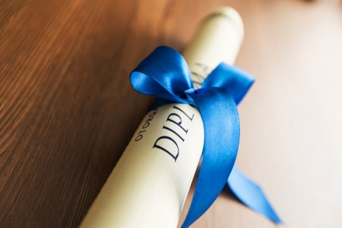 A rolled-up diploma.