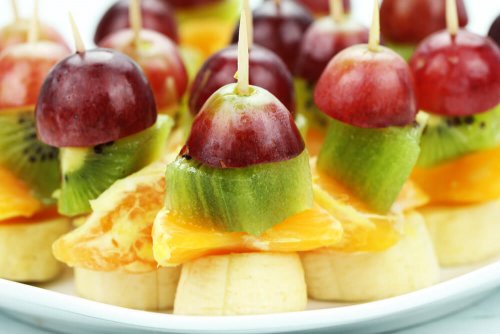 A tray of fruit kabobs.