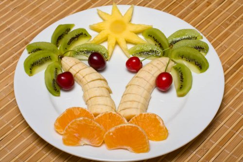 A tropical scene made with fruit.