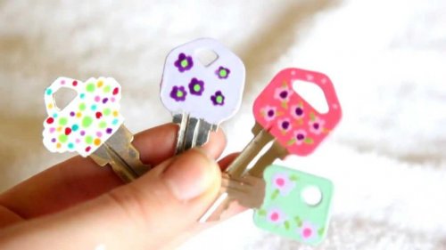 Four keys with painted flowers.