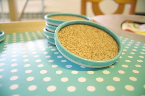 Drink coasters made with lids and cork.