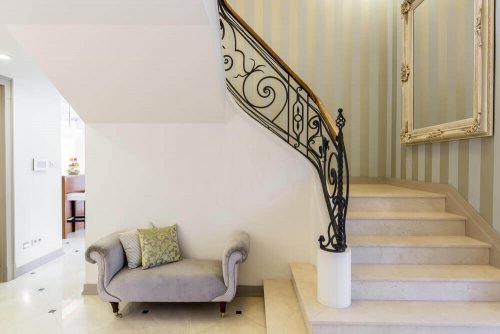 An art-nouveau-inspired staircase railing.