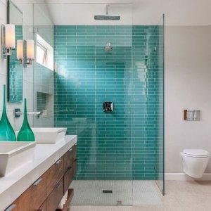 Turquoise shower tiles.