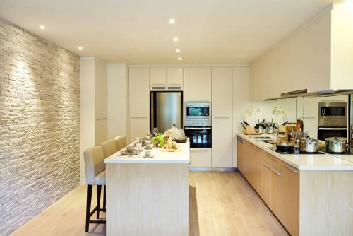 A kitchen using lighting for extra texture.