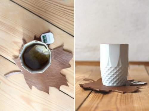 A cup on a leather coaster.