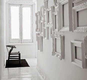 A hall with picture frames.