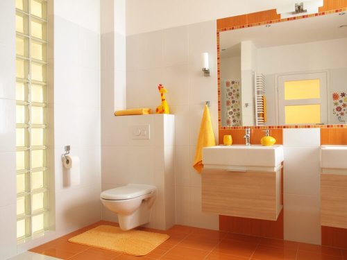 A bathroom decorated in orange tones.