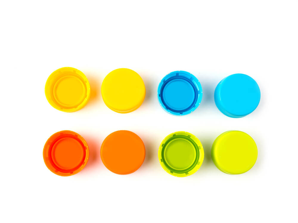Brightly colored plastic bottle lids