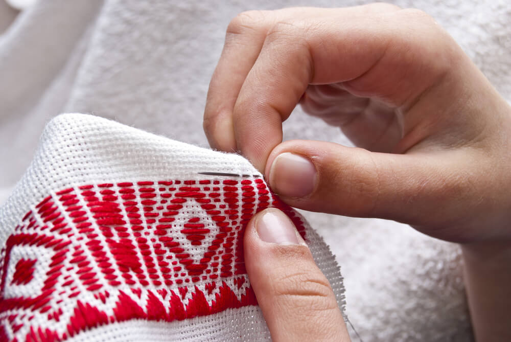 A close up of a hand stitched border