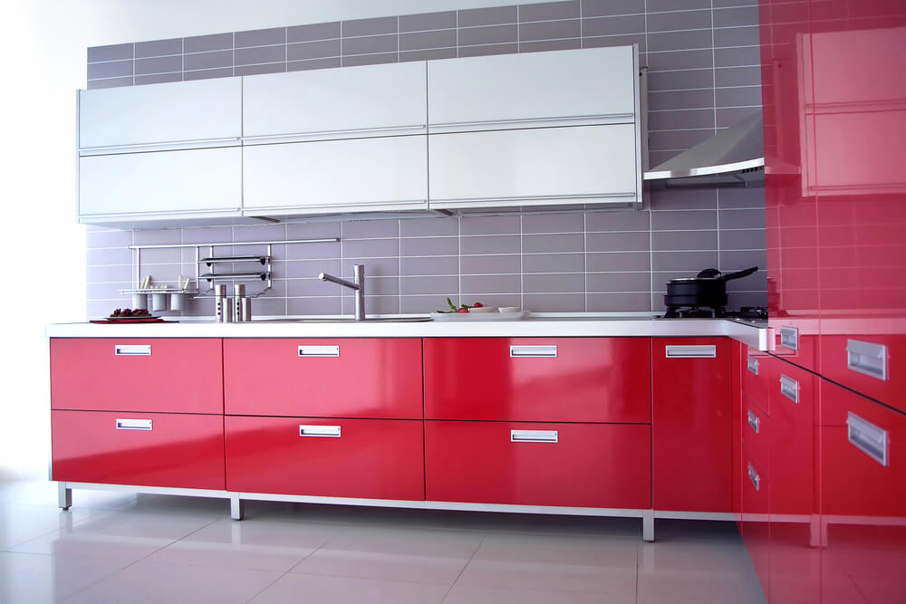 A contrast between scarlet drawers and gray tiled walls