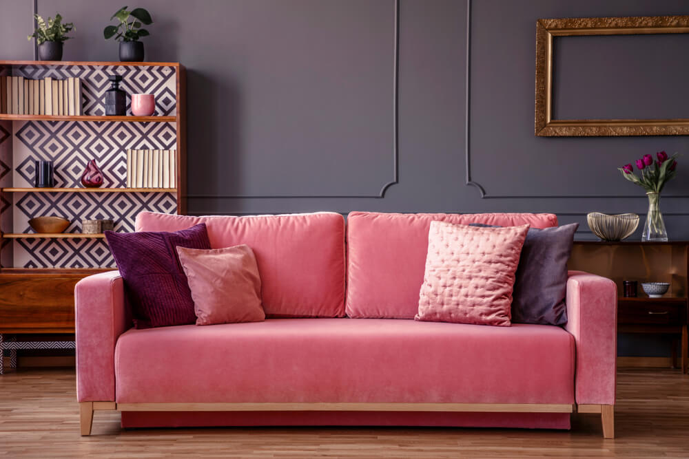 A pink velvet sofa