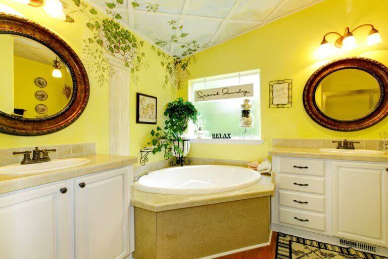 A classy yellow bathroom with white and beige furnishings