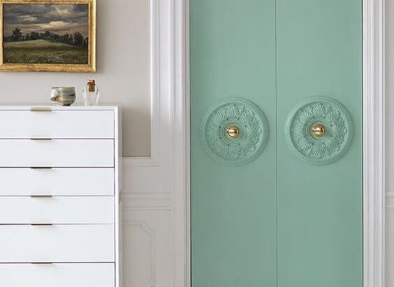 Pastel teal doors with art deco trim
