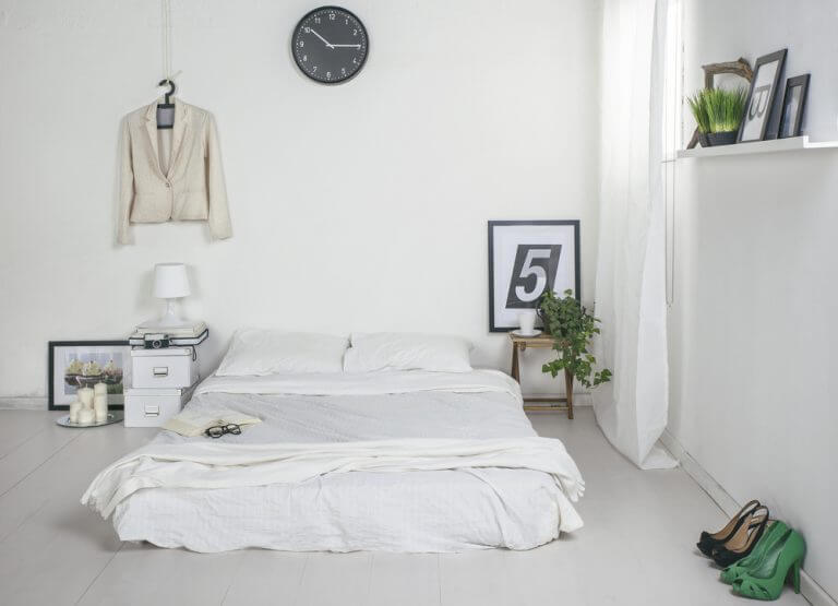 A minimalist bedroom containing only what is really needed