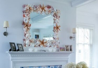 A mirror frame with seashells.