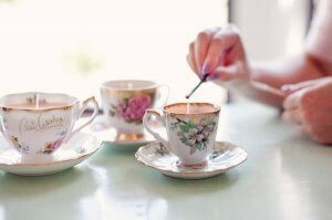 Coffee mug candle holders.