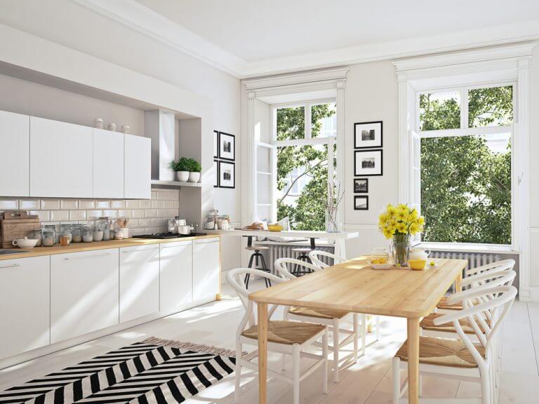 An airy open plan kitchen design with a dining area included