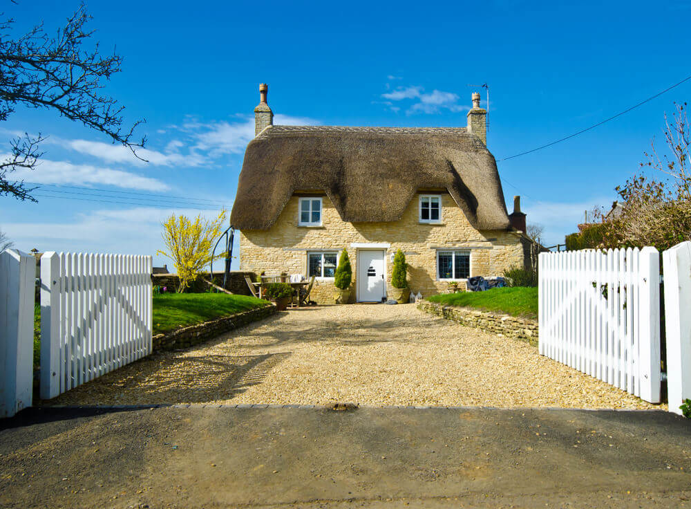 An example of English Cottage style houses with attic windows and chimneys
