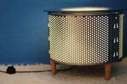 A table made out of a washing machine drum.