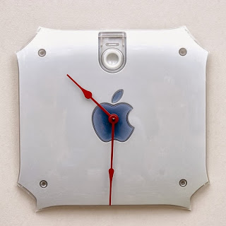 An apple clock made from recycled materials