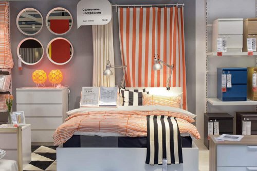 The shop window of a furniture store showcasing a bedroom.