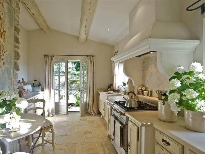 Natural stone floor, ceramic flower pots and rustic ceiling beams