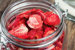 A mason jar of strawberries.