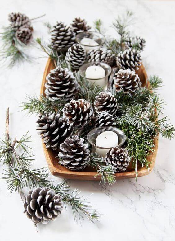 Autumn themed table decoration using pine cones