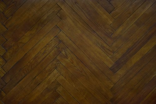 A dark colored parquet floor.