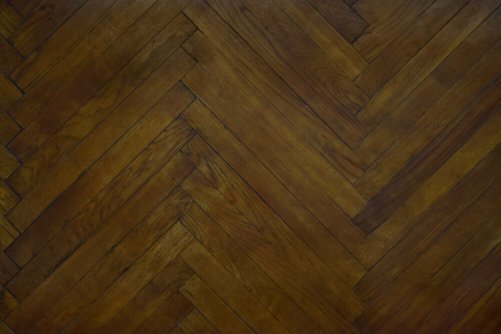 A dark colored parquet floor.