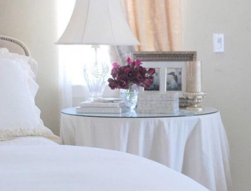 A round table in a bedroom.
