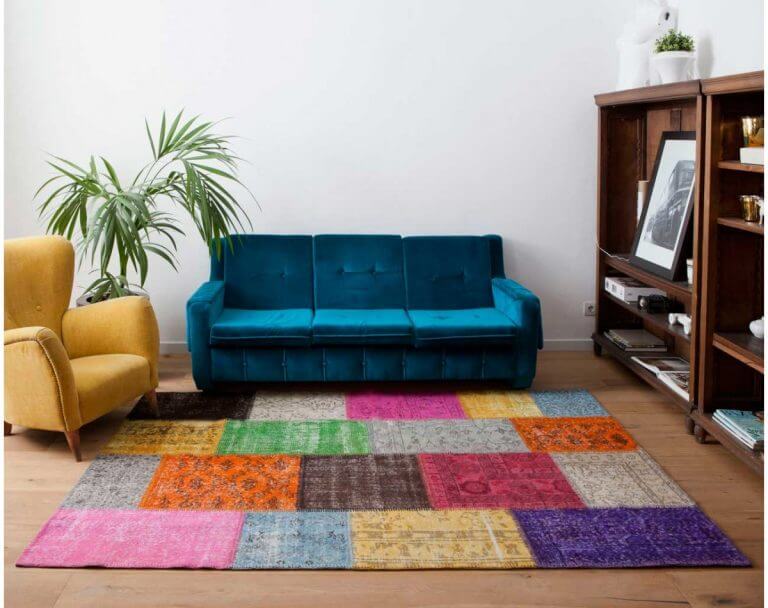 Include a large colorful rug to increase the visual space