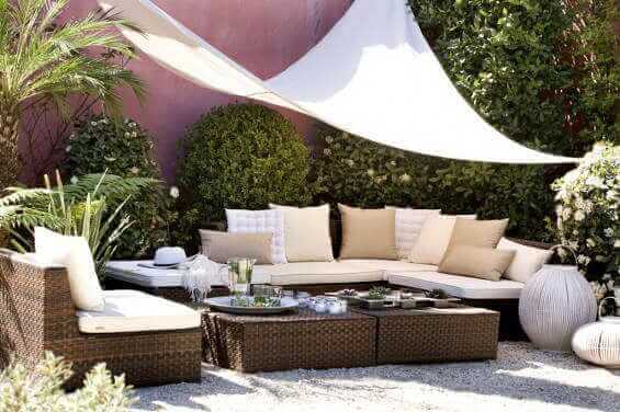 Various cushions under a tarpaulin.