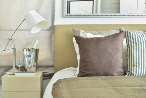 An adjustable lamp on a nightstand.
