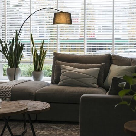 An arc lamp over a sofa.