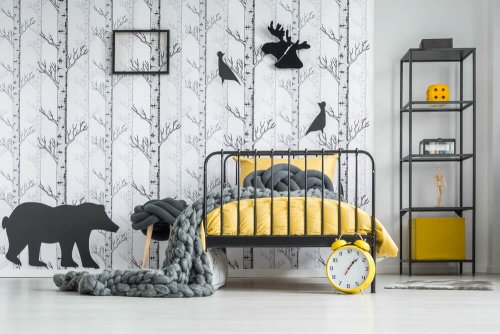 A bedroom decorated in yellow and gray.