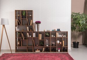 A small bookshelf with various objects on it