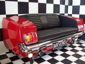 A car couch against a checkerboard design