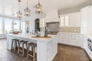 A simply decorated kitchen with white cabinets