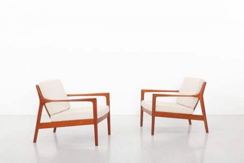 Two brown and white Ohlsson chairs.