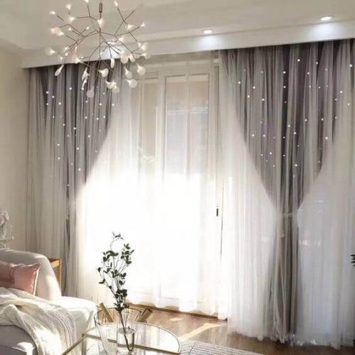 Long gray curtains and sheers on the windows