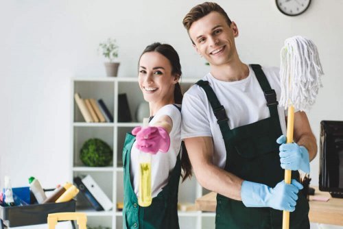 A man and a woman deep cleaning their home.